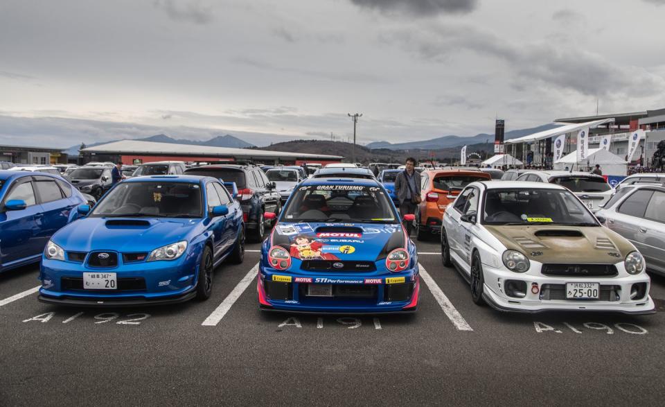 <p>We noted plenty of modified Subarus wearing homages to popular Anime characters; see: the Impreza in the middle of this photo. </p>