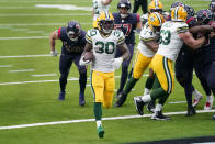 Green Bay Packers running back Jamaal Williams (30) scores during the second half of an NFL football game against the Houston Texans Sunday, Oct. 25, 2020, in Houston. (AP Photo/Sam Craft)