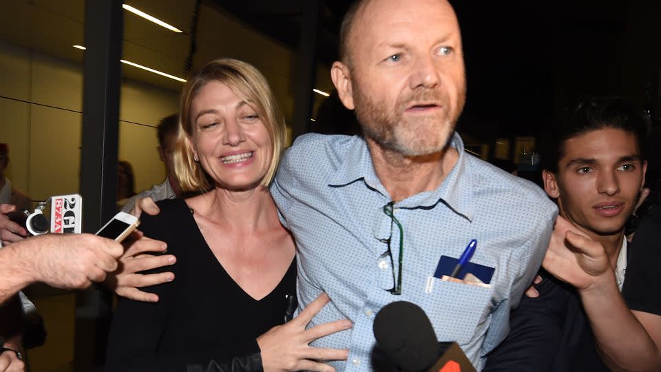 60 Minutes journalist Tara Brown and 60 Minutes producer Stephen Rice arrive at Sydney International Airport, Thursday, April 21. Photo: AAP