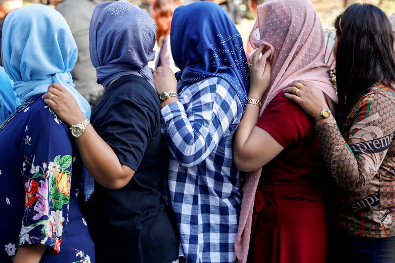 Relatives of the accused in the 2009 Maguindanao Massacre in southern Philippines, arrive at a police headquarters for the promulgation of the case in Taguig City