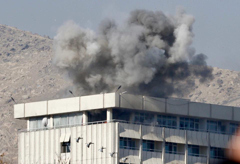 <p>Smoke billows from the Intercontinental hotel after an attack by armed gunmen in Kabul, Afghanistan on January 21, 2018. At least 18 people, including 14 foreigners, were killed in an attack on the Intercontinental Hotel in the Afghan capital Kabul. The attack, which has since been claimed by the Taliban, began on the evening of January 20, just as guests were dining in the restaurant area, and lasted close to 12 hours before Afghan security forces were able to put an end to the ordeal. (Photo: Jawad Jalali/EPA-EFE/REX/Shutterstock) </p>