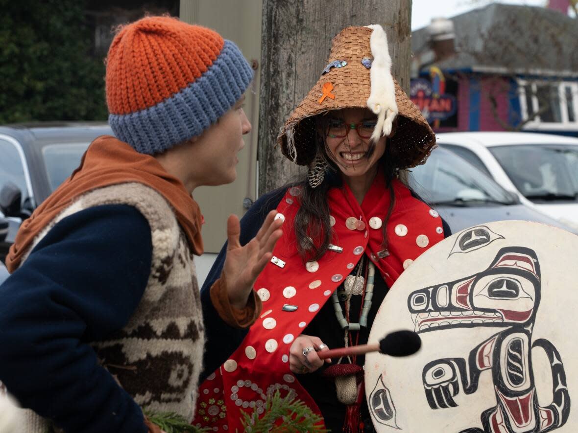 Angela (Rainbow Eyes) Davidson is seen with supporters outside the Nanaimo, B.C., courthouse earlier this month. The Fairy Creek protest organizer was sentenced to 60 days in jail after being found guilty of criminal contempt. (Claire Palmer/CBC - image credit)