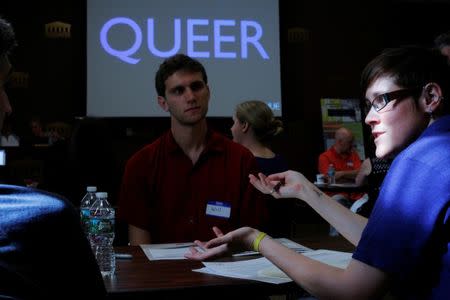 Sixth grade reading and writing teacher Steph Cosantino talks to other educators during a training session with the group History Unerased (HUE), which aims to provide educators with materials about the role lesbian, gay bisexual and transgender people have played in the history of the United States, in Lowell, Massachusetts, U.S., May 18, 2017. REUTERS/Brian Snyder