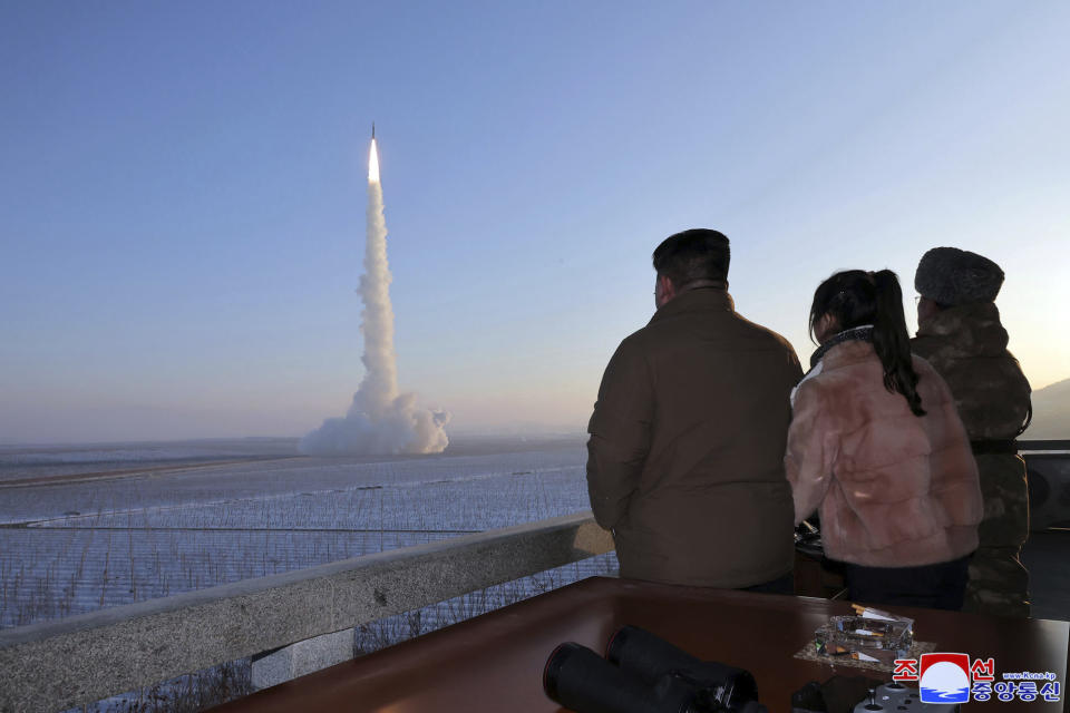 FILE - In this undated photo provided Monday, Dec. 18, 2023, by the North Korean government, North Korean leader Kim Jong Un, his daughter and an official watch what it says is an intercontinental ballistic missile launching from an undisclosed location in North Korea. Independent journalists were not given access to cover the event depicted in this image distributed by the North Korean government. The content of this image is as provided and cannot be independently verified. Korean language watermark on image as provided by source reads: "KCNA" which is the abbreviation for Korean Central News Agency. (Korean Central News Agency/Korea News Service via AP, File)