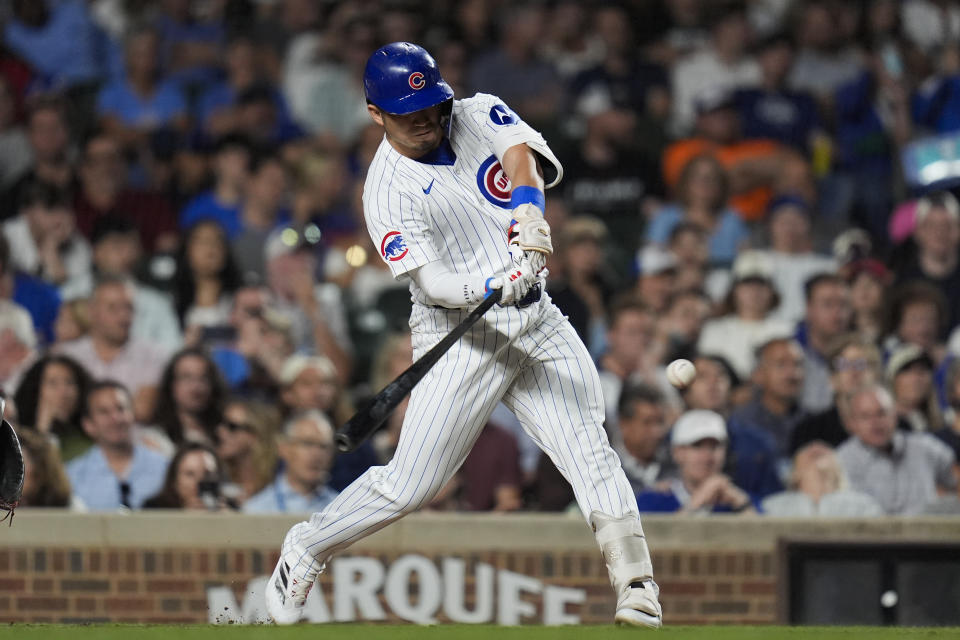 Chicago Cubs designated hitter Seiya Suzuki hits a two-run home run during the third inning of a baseball game against the Washington Nationals, Thursday, Sept. 19, 2024, in Chicago. (AP Photo/Erin Hooley)