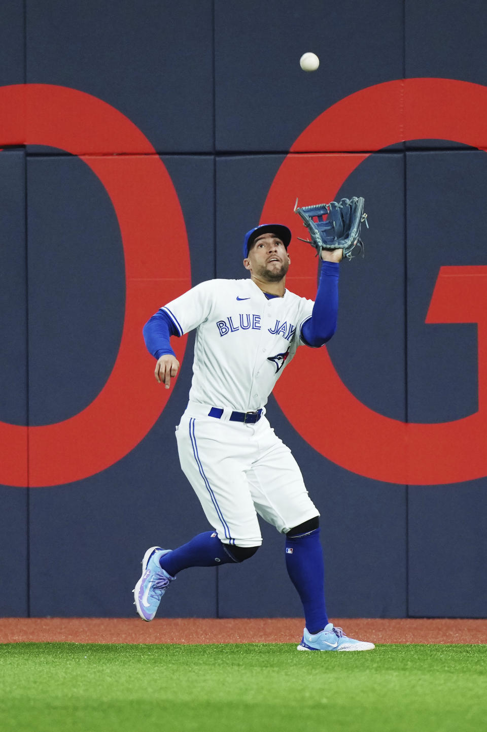Toronto Blue Jays right fielder George Springer (4) makes a catch against the Philadelphia Phillies during the seventh inning of a baseball game in Toronto on Tuesday, Aug. 15, 2023. (Nathan Denette/The Canadian Press via AP)