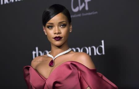 Singer Rihanna poses at the First Annual Diamond Ball fundraising event at The Vineyard in Beverly Hills, California December 11, 2014. REUTERS/Mario Anzuoni