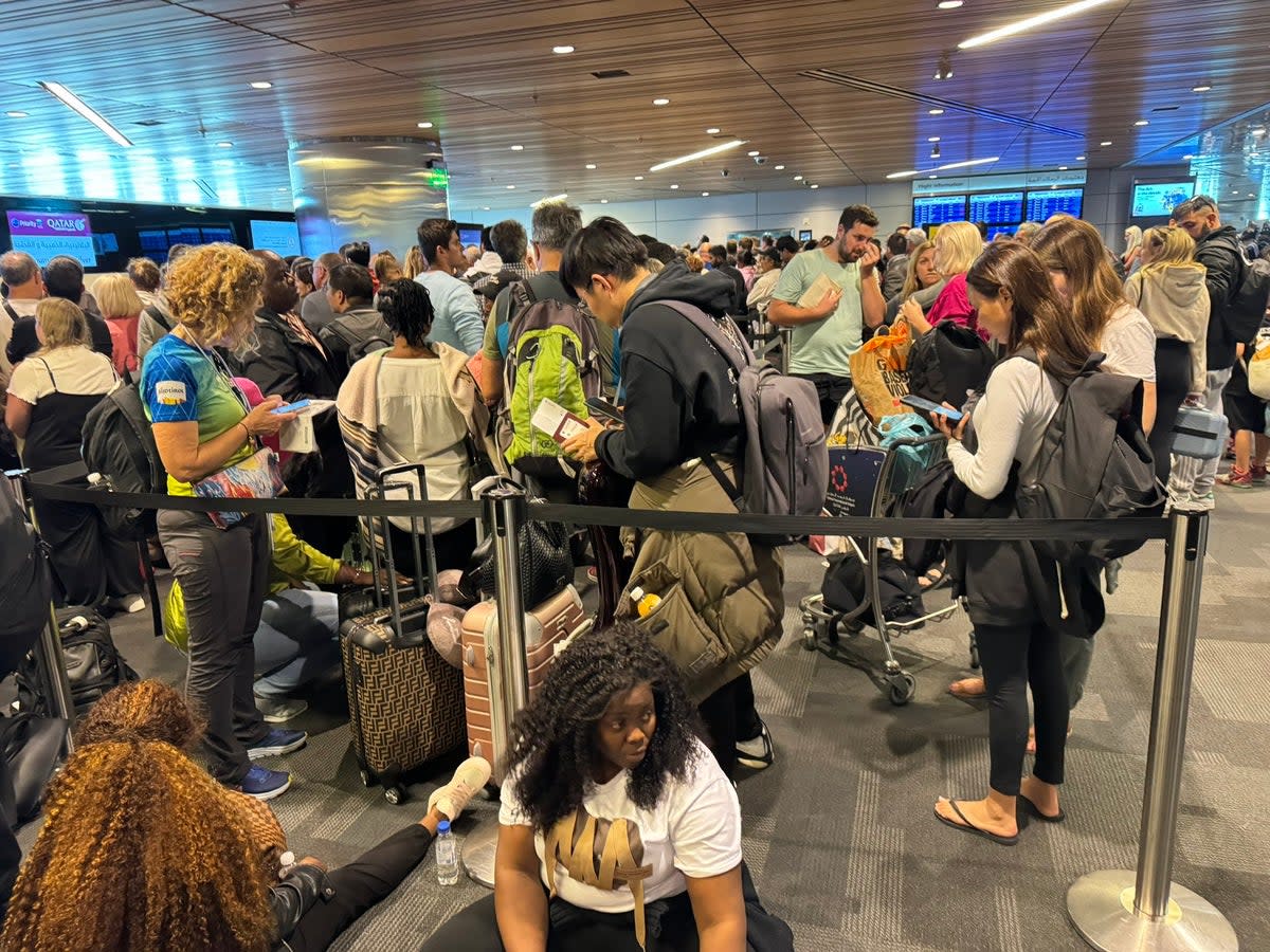 Storm damage: Passengers waiting at Doha airport waiting to be rebooked (Hugh Davison)