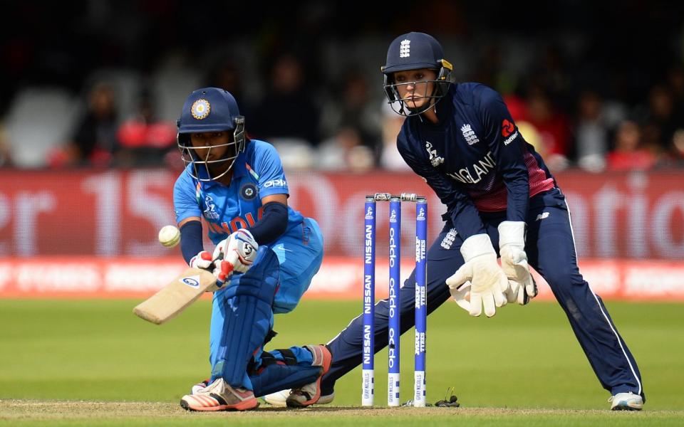 Punam Raut executes a paddle sweep during her partnership with Harmanpreet Kaur  - Credit: Getty