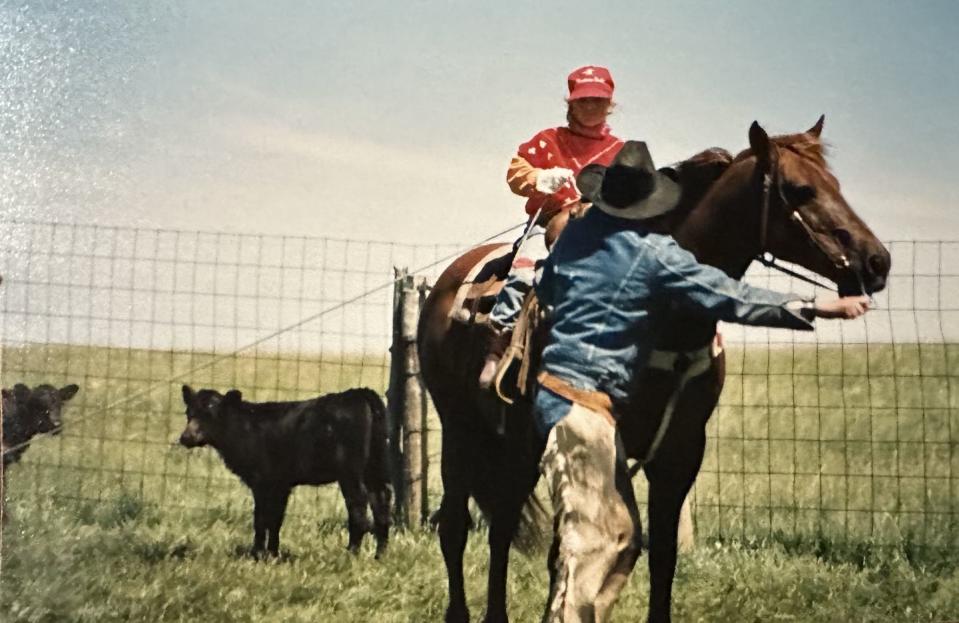 mackenzie porter on the ranch as a child, learning how to ride a horse with an adult instructor