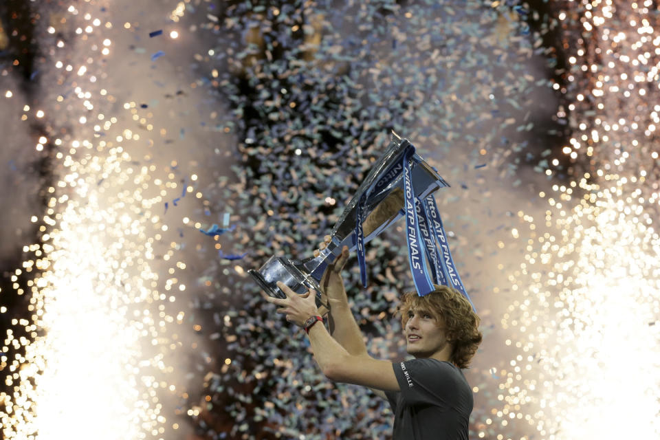 FILE - In this Sunday Nov. 18, 2018 file photo, Alexander Zverev of Germany holds up the trophy after defeating Novak Djokovic of Serbia in their ATP World Tour Finals singles final tennis match at the O2 Arena in London. The ATP Finals is moving to the Italian city of Turin in 2021, the ATP is expected to announce the move Wednesday April 24, 2019. (AP Photo/Tim Ireland, File)