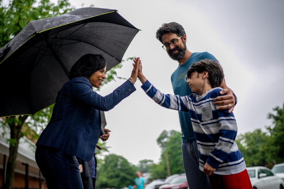 PHOTO: Maryland Democratic candidate for Senate and Prince George's County Executive Alsobrooks high fives with Ryan Cunningham's son outside a voting location for the state primary election at Eastern Middle School on May 14, 2024 in Silver Spring, Md. (Andrew Harnik/Getty Images)