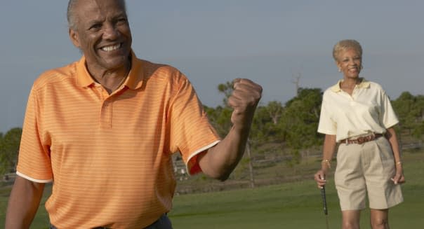 Senior African American couple on golf course