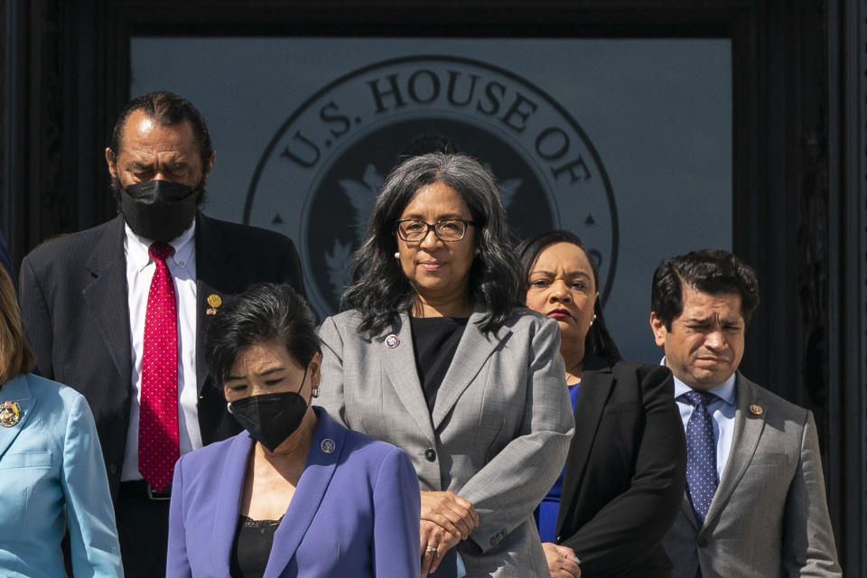 Rep. Marilyn Strickland, D-Wash., center, walks down the steps with other members of the House during an event on steps of the House of Representatives on the East Front of the U.S. Capitol, in Washington, Wednesday, March 16, 2022. Basic allowance for housing is like an “algorithm that needs updating on a regular basis,” said Strickland, whose district includes the massive Joint Base Lewis-McChord near Tacoma, where many military families struggle to find affordable homes. Her proposal is part of the national defense bill that passed the House in July and is awaiting Senate approval. (AP Photo/Alex Brandon)