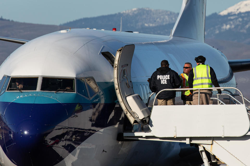 Agents working for U.S. Immigration and Customs Enforcement (ICE) prepare to board detainees onto a Swift Air charter flight at McCormick Air Center on February 18, 2020 in Yakima, Washington.  / Credit: / Getty Images