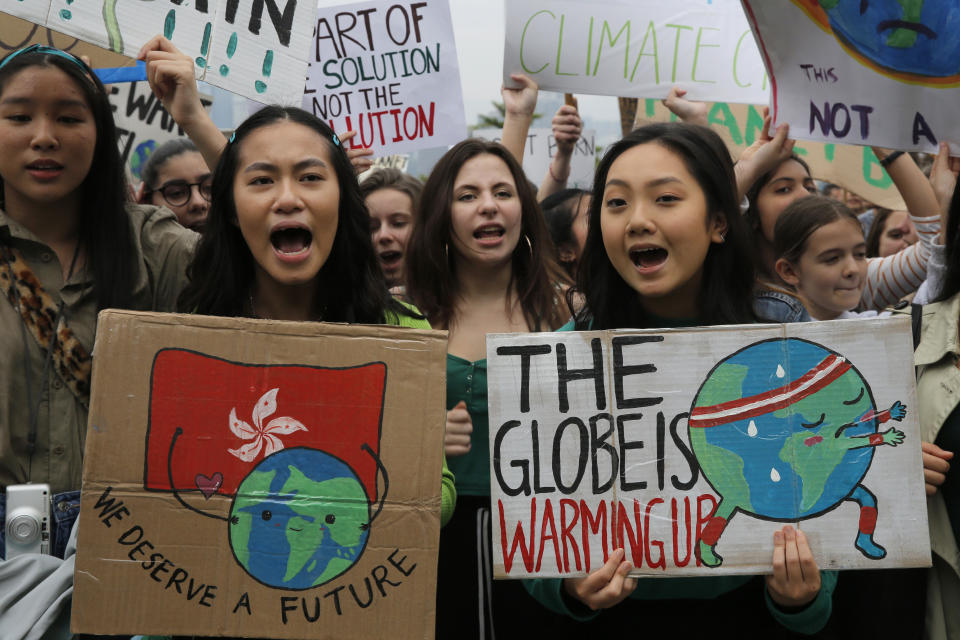 Hundreds of schoolchildren take part in a climate protest in Hong Kong, Friday, March 15, 2019. Students in more than 80 countries and territories worldwide plan to skip class Friday in protest over their governments' failure to act against global warming. The coordinated 'school strike' was inspired by 16-year-old activist Greta Thunberg, who began holding solitary demonstrations outside the Swedish parliament last year. (AP Photo/Kin Cheung)