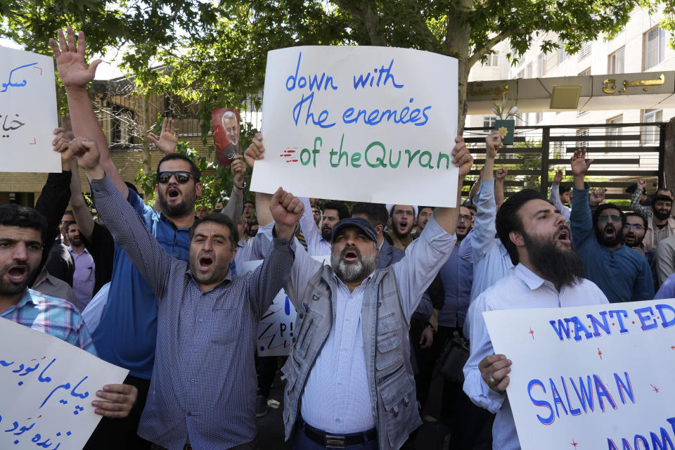 Iranian demonstrators chant slogans during a protest of the burning of a Quran in Sweden, in front of the Swedish Embassy in Tehran, Iran, Friday, June 30, 2023. On Wednesday, a man who identified himself in Swedish media as a refugee from Iraq burned a Quran outside a mosque in central Stockholm. (AP Photo/Vahid Salemi)