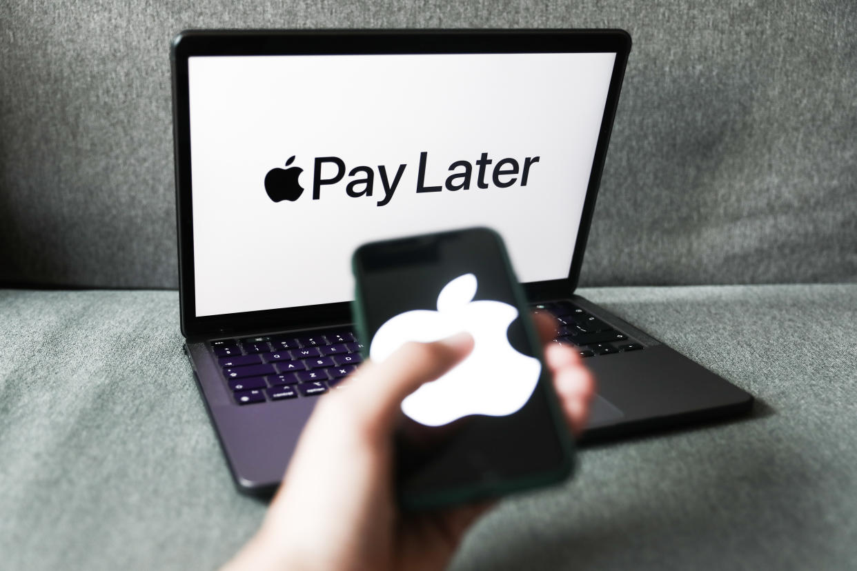 Apple Pay Later logo displayed on a laptop screen and Apple logo displayed on a phone screen are seen in this illustration photo taken in Krakow, Poland on June 7, 2022. (Photo by Jakub Porzycki/NurPhoto via Getty Images)