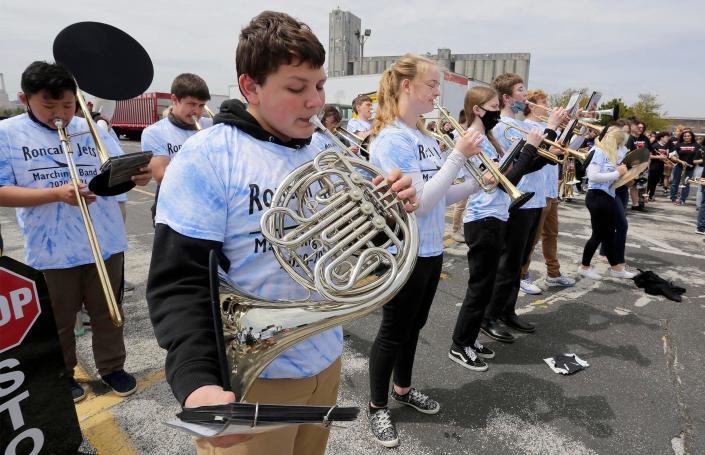 Members of the Roncalli band perform while waiting for the arrival of the S.S. Badger, Thursday, May 20, 2021, in Manitowoc, Wis.
