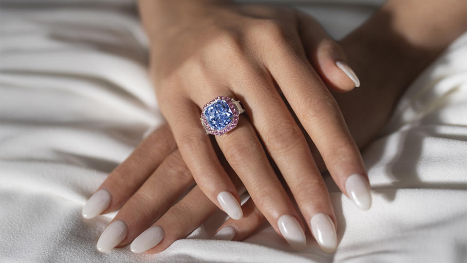 The 11.28-carat blue diamond, mounted onto a diamond ring 