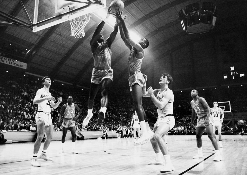 David Lattin (42) and a Texas Western teammate compete for control of a rebound as Kentucky's Tommy Kron, left, and Pat Riley , right, look on during the 1966 NCAA Photos via Getty Images Championship.  Texas Western defeated Kentucky 72-65 for the championship title and was the first team to have an.. all-.black starting five compete in the NCAA Photos via Getty Images final. Rich Clarkson/NCAA Photos via Getty Images