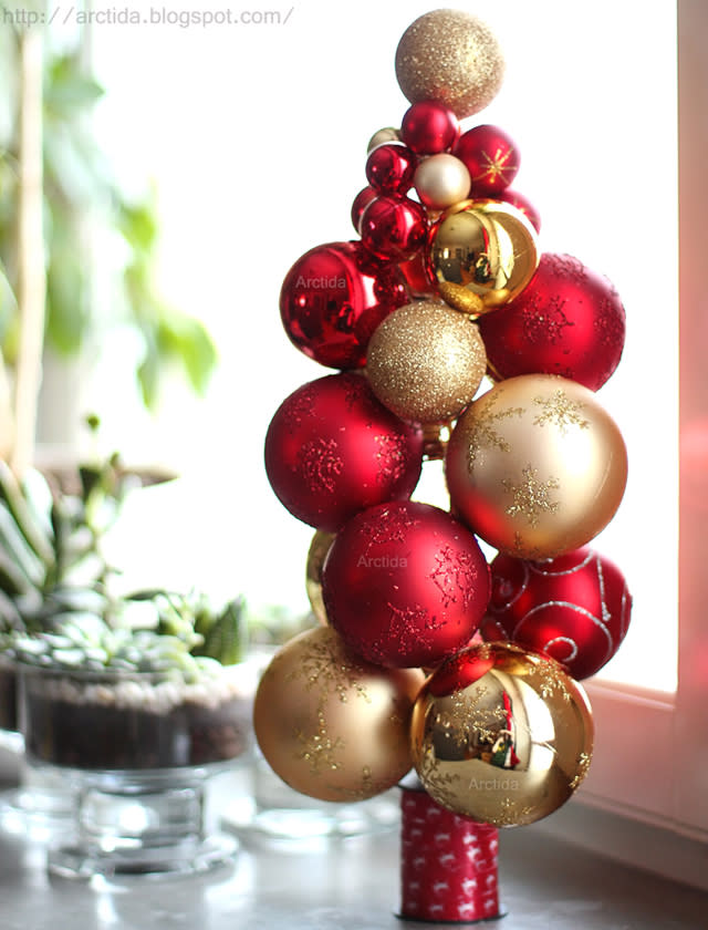 Create your very own mini Christmas tree using baubles and a few things from the sewing kit.