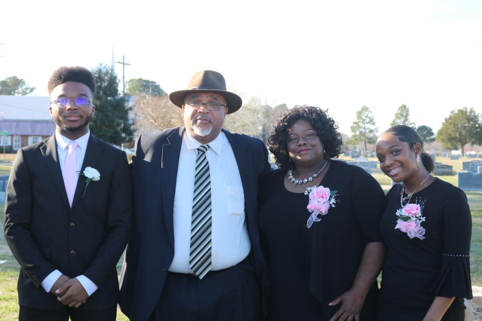 A Hampton Inn desk clerk called police on Delores Corbett, second from right, and her family over a billing error that was the hotel's fault.