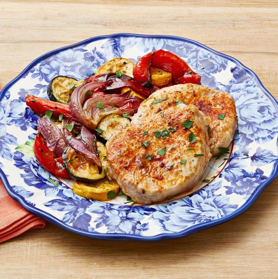 sheet pan ranch pork and veggies on blue plate