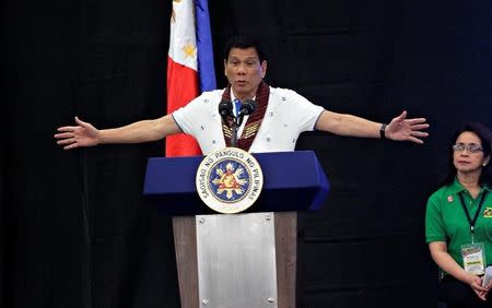 President Rodrigo Duterte speaks during a meeting with banana production businessmen in Davao city, in southern Philippines, October 7, 2016. REUTERS/Lean Daval Jr