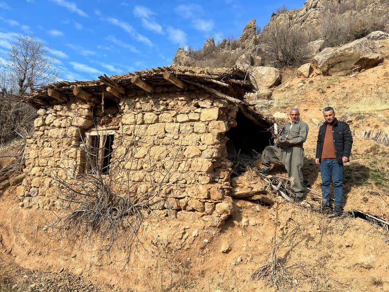 Sararo villagers show the damage, they say, was caused by Turkish bombardment on their village, in Dohuk