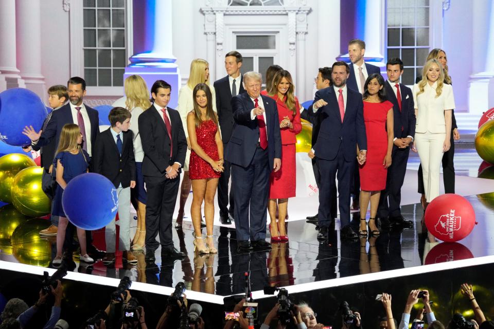 Republican presidential nominee Donald Trump and his family, along with vice presidential nominee JD Vance and his wife, celebrate on the final day of the Republican National Convention in Milwaukee on July 18, 2024.