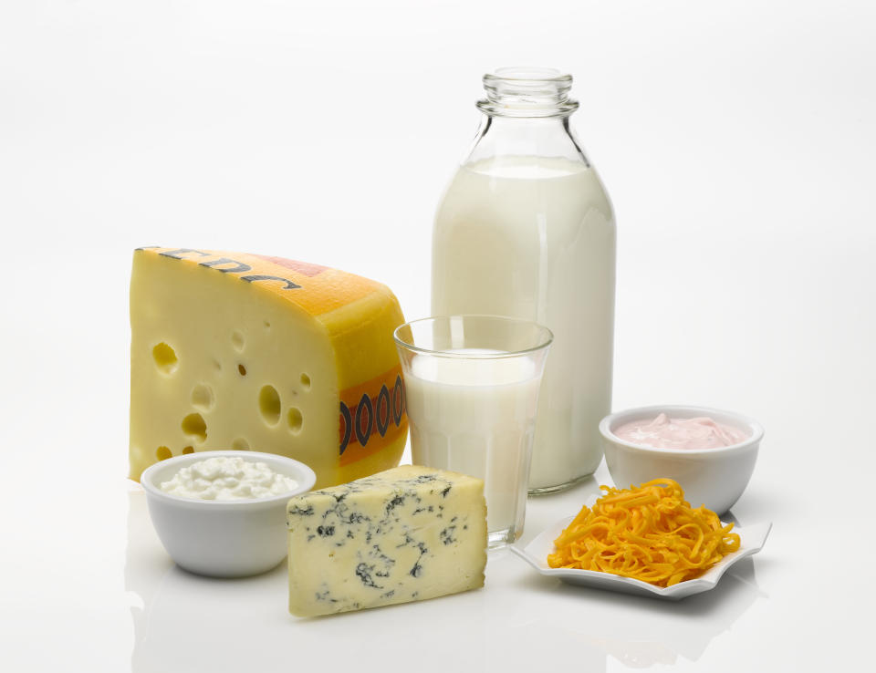 milk, cheese and yoghurt against a white background