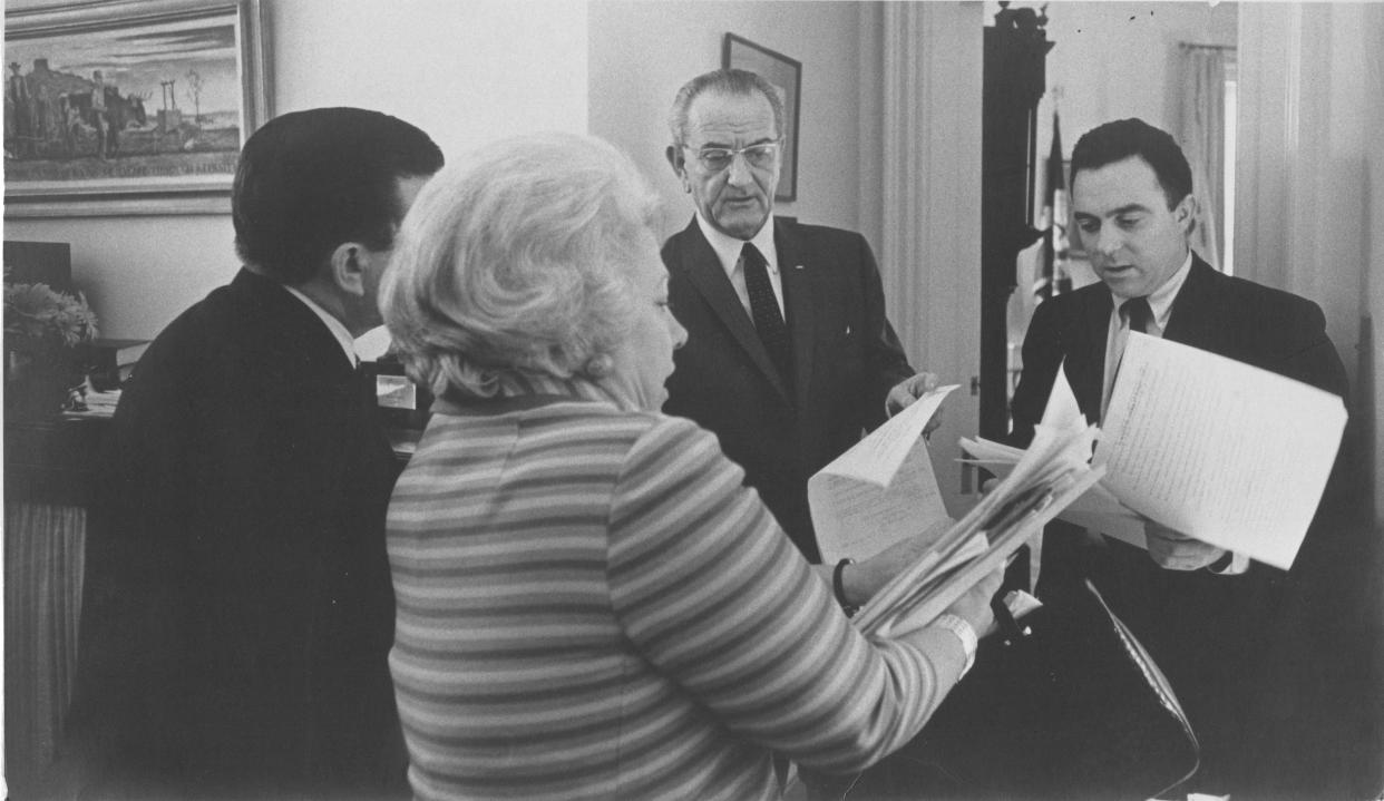 President Lyndon Johnson, Secretary of Health Education and Welfare Joseph Califano Jr. and Liz Carpenter work on a speech. A journalist trained at the University of Texas, Carpenter penned many a critical speech, including the one LBJ delivered upon his return to Washington after the assassination of President John F. Kennedy.