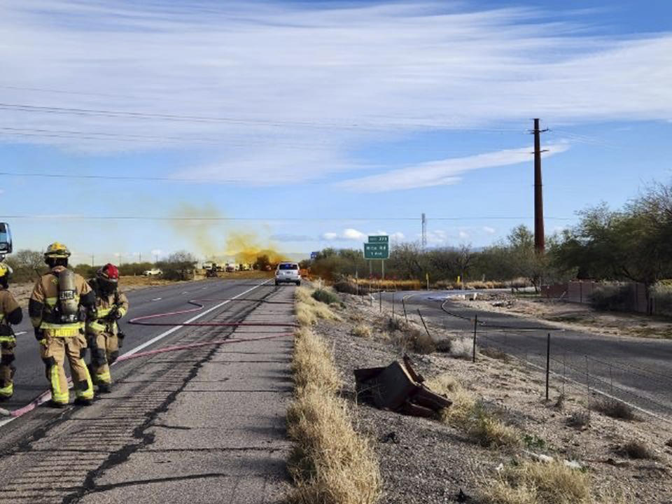 This image provided by the Arizona Department of Public Safety shows what the department says was an accident involving a commercial tanker truck that caused a hazardous material to leak onto Interstate 10 outside Tucson, Ariz., on Tuesday, Feb. 14, 2023, prompting state troopers to shut down traffic on the freeway. (Arizona Department of Public Safety via AP)