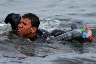 FILE PHOTO: Thousands of migrants cross the Spanish-Moroccan border