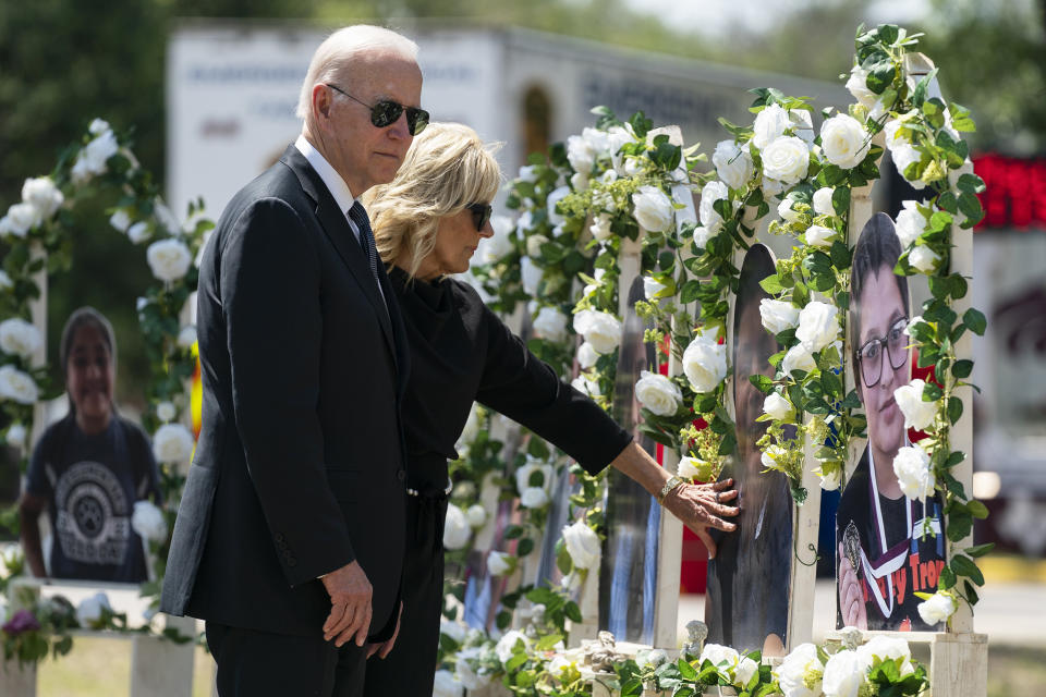 FILE - President Joe Biden and first lady Jill Biden visit a memorial at Robb Elementary School to pay their respects to the victims of the mass shooting May 29, 2022, in Uvalde, Texas. (AP Photo/Evan Vucci, File)