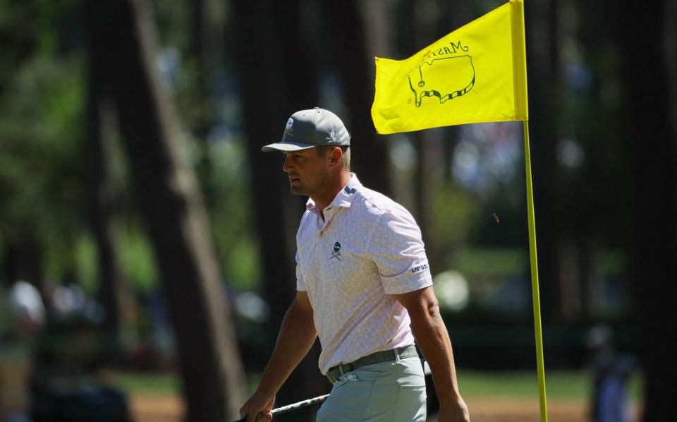 Bryson DeChambeau walks off the third green