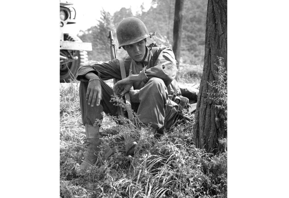 A grim battle experience is reflected in the youthful face of Pfc. William McLendon of Columbia, S.C., as he takes a breather under a tree near the Masan sector in Korea, Sept. 12, 1950. Gene Herrick, a retired Associated Press photographer who covered the Korean War and is known for his iconic images of Martin Luther King Jr., Rosa Parks and the trial of the killers of Emmett Till in the early years of the Civil Rights Movement, died Friday, April 12, 2024. He was 97. (AP Photo/Gene Herrick, file)
