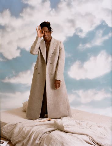 <p>Brad Ogbonna</p> Emporio Armani vest and pants. Michael Kors Collection coat. Jon Batiste's own jewelry.