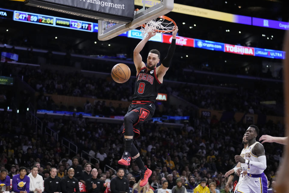 Chicago Bulls guard Zach LaVine dunks against the Los Angeles Lakers during the first half of an NBA basketball game, Sunday, March 26, 2023, in Los Angeles. (AP Photo/Marcio Jose Sanchez)