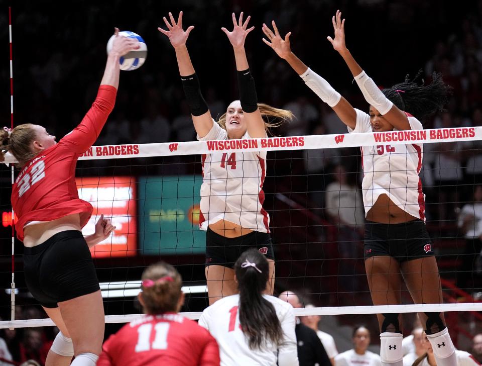 Wisconsin's Anna Smrek (14) and Carter Booth (52), shown against Ohio State earlier this season, are among the Big Ten leaders in blocks.