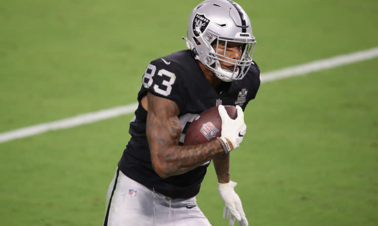 Darren Waller of the Raiders runs with the football.