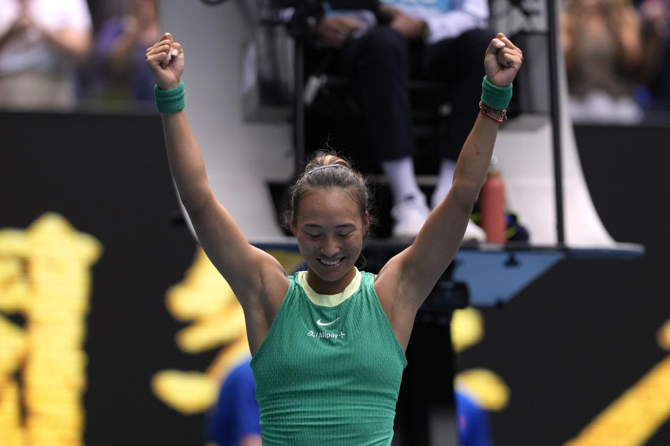 Zheng Qinwen of China celebrates after defeating compatriot Wang Yafan in their third round match at the Australian Open tennis championships at Melbourne Park, Melbourne, Australia, Saturday, Jan. 20, 2024. (AP Photo/Andy Wong)