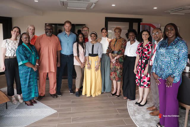<p>Musa Pem/Save the Children</p> Prince Harry and Meghan Markle pose for a group photo with Save the Children staff, Youth Ambassadors and Global Ambassador Misan Harriman in Abuja, Nigeria, in May 2024.