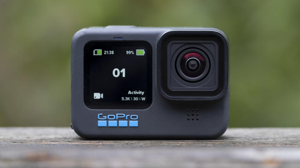 The GoPro Hero 11 Black action camera sitting on a wooden platform