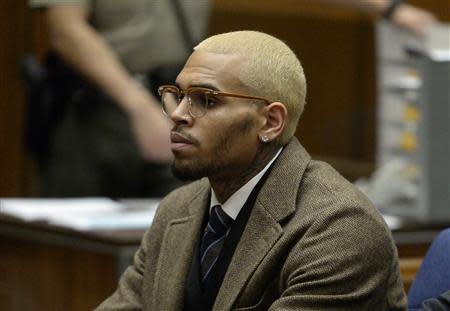 Singer Chris Brown appears in court during a probation violation hearing in which his probation was revoked at Los Angeles Superior Court in Los Angeles, December 16, 2013. REUTERS/ Kevork Djansezian/Pool