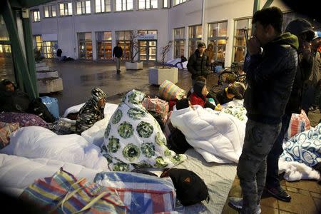 Refugees sleep outside the entrance of the Swedish Migration Agency's arrival center for asylum seekers at Jagersro in Malmo, Sweden, November 20, 2015. REUTERS/Stig-Ake Jonsson/TT News Agency