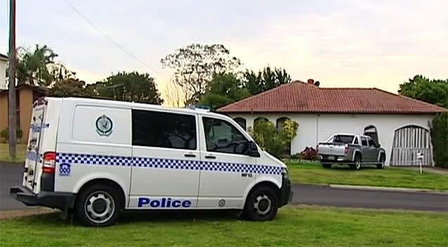 A police van sits outside the family's Campbelltown home. Photo: 7 News