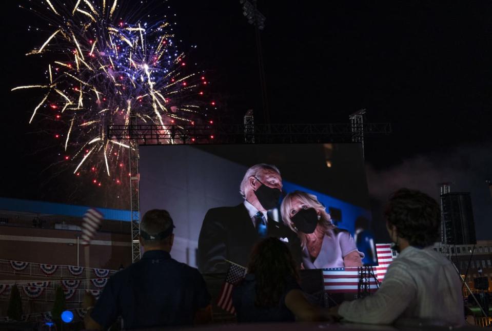 <div class="inline-image__caption"><p>Supporters cheered from their cars as Democratic presidential candidate and former Vice President Joe Biden and his wife, Jill, appeared on a huge monitor as fireworks lit up the night sky on the fourth day of the Democratic National Convention, Thursday, Aug. 20, 2020, outside of the Chase Center in Wilmington, Del.</p></div> <div class="inline-image__credit">Carolyn Kaster/AP</div>