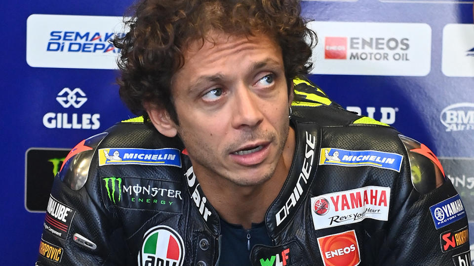 Valentino Rossi, pictured here looking on in the garages.